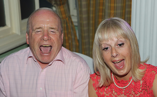 bursting with laughter at seeing their cartoon