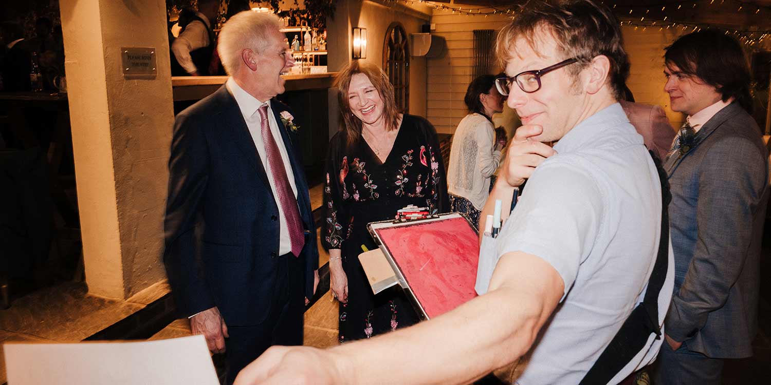 impressed caricaturist at corporate dinner