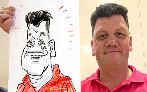 staff member with caricature drawing